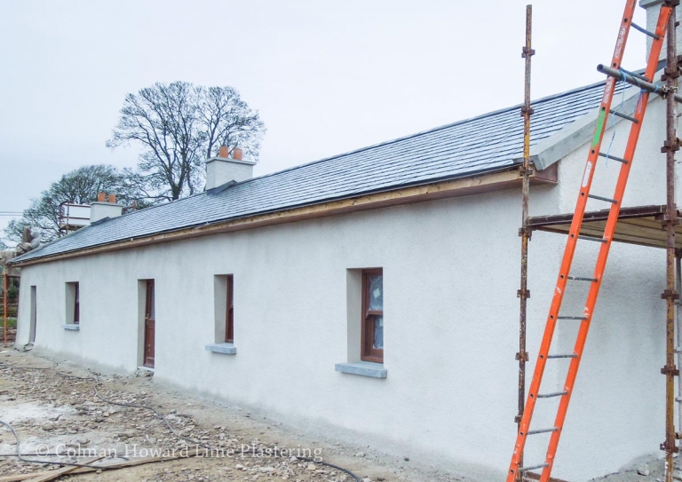 Wet dash (also known as harling or rough cast).The final coat of this